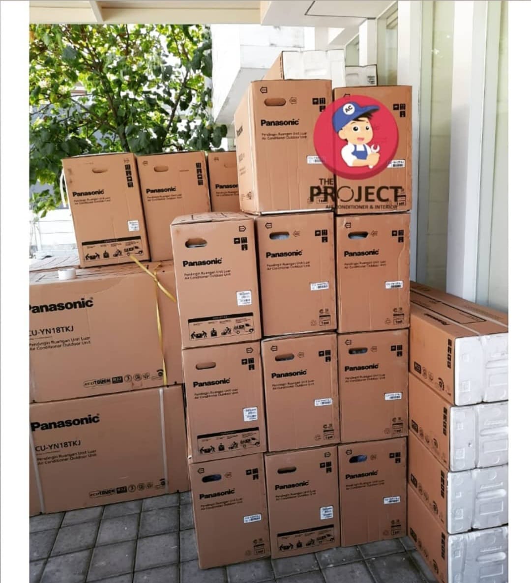 Bulk Panasonic AC outdoor unit boxes ready for multi-unit residential installation project